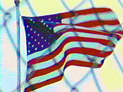 Flag Behind Fence