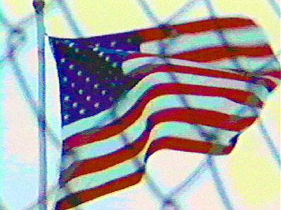 Flag Behind Fence